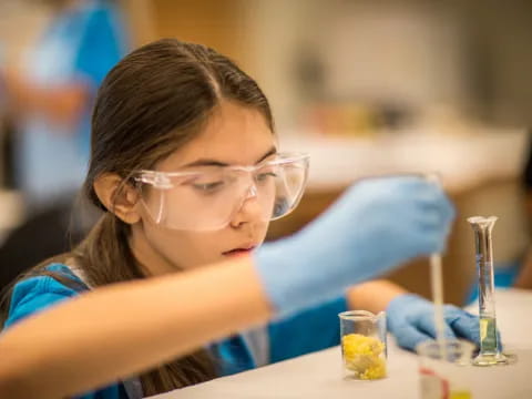 a young girl wearing glasses