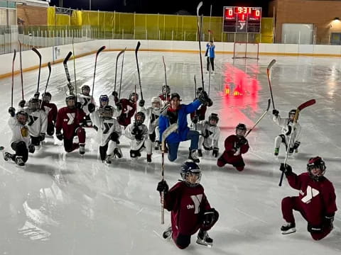 a group of people playing hockey