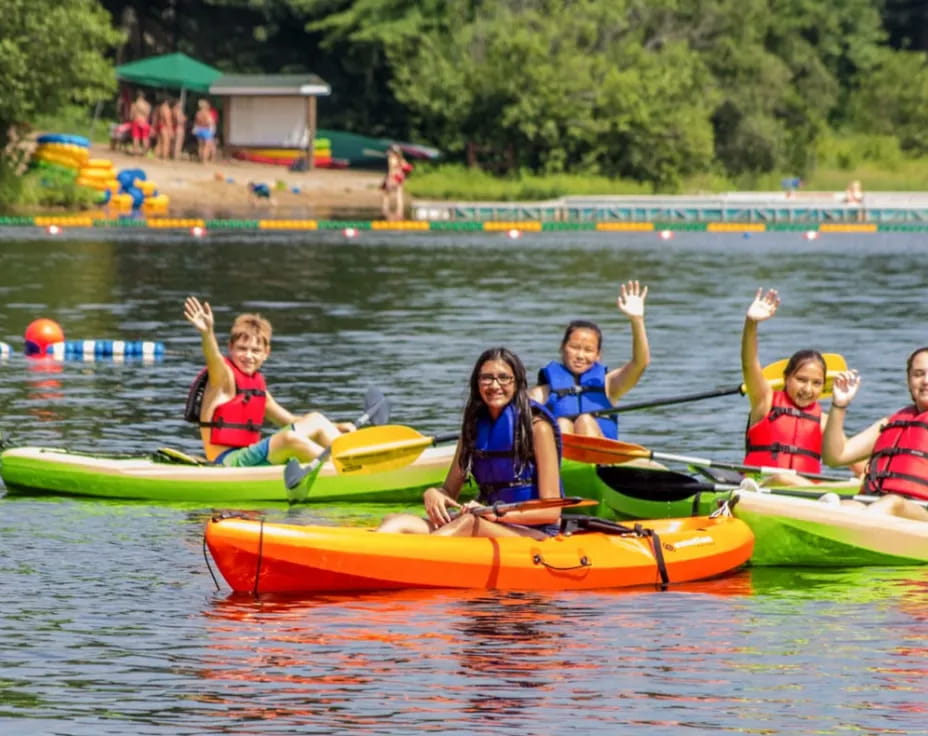 a group of people in canoes