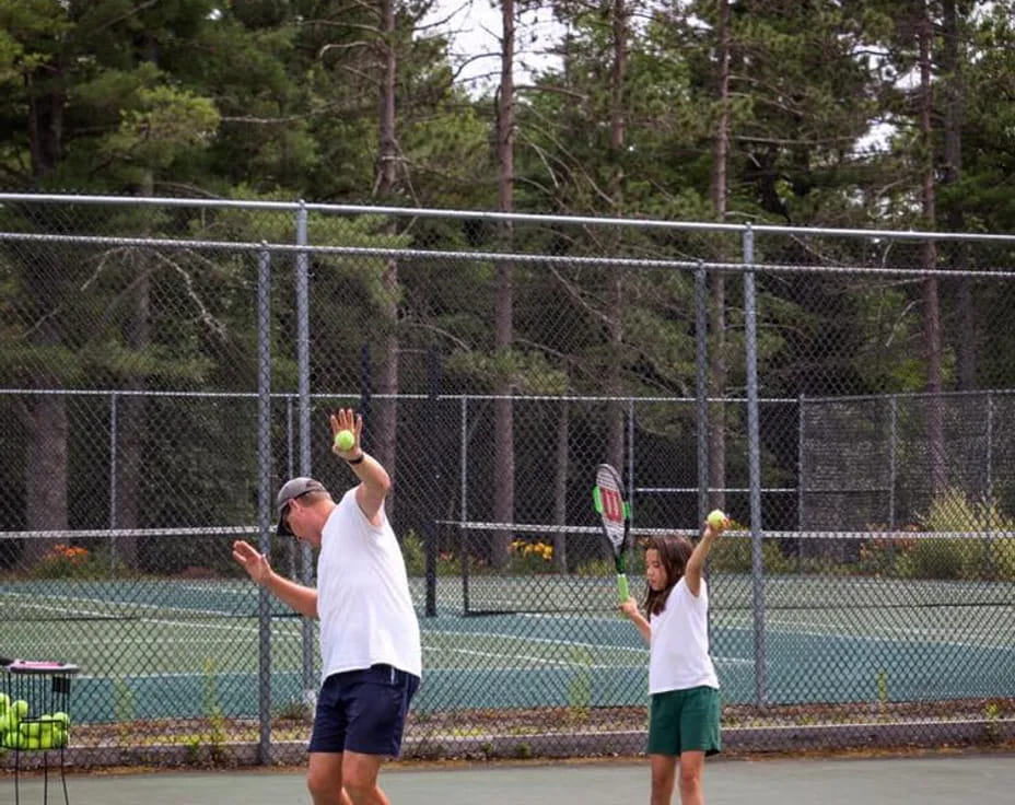 a man and a woman playing tennis