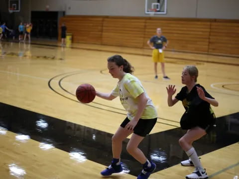 a couple of girls playing basketball