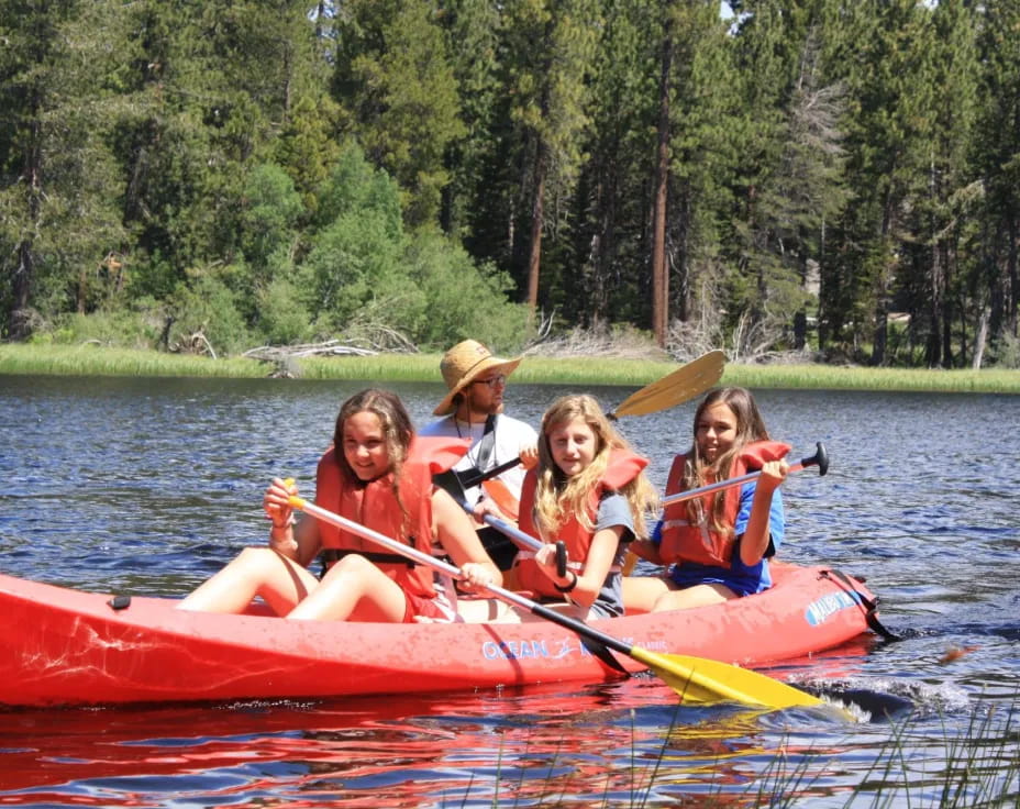a group of people in a canoe
