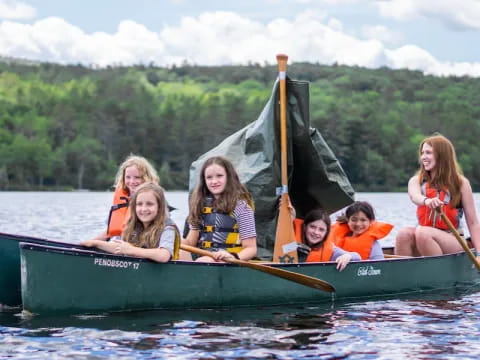 a group of people in a canoe