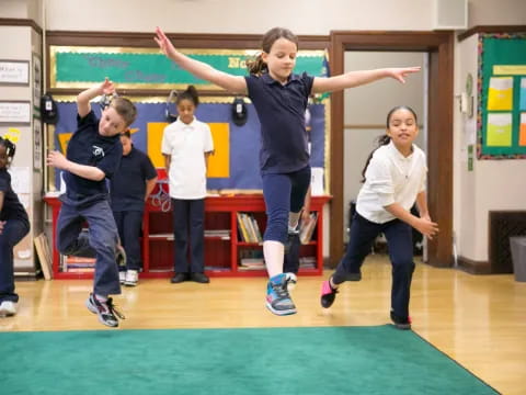 a group of children jumping in the air