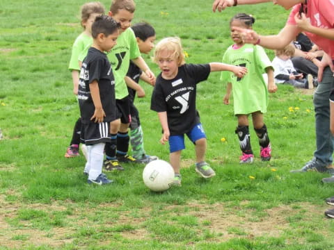 kids playing football on a field