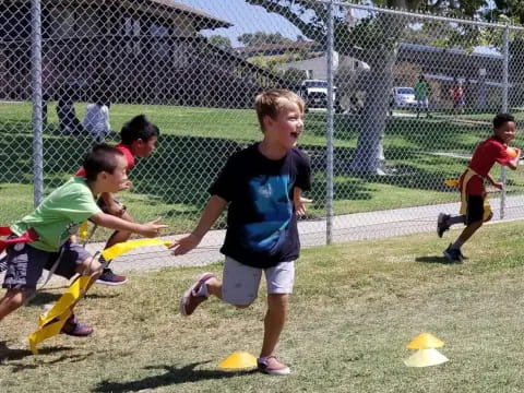 a group of kids playing with sticks