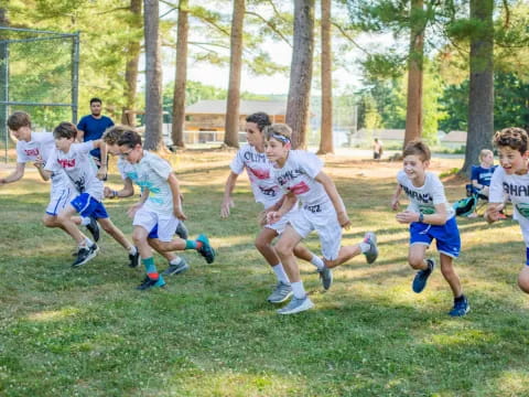 a group of kids playing rugby