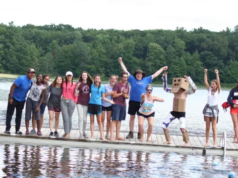 a group of people standing on a dock