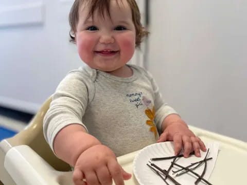 a child sitting at a table