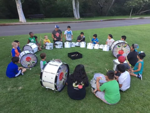 a group of people playing drums