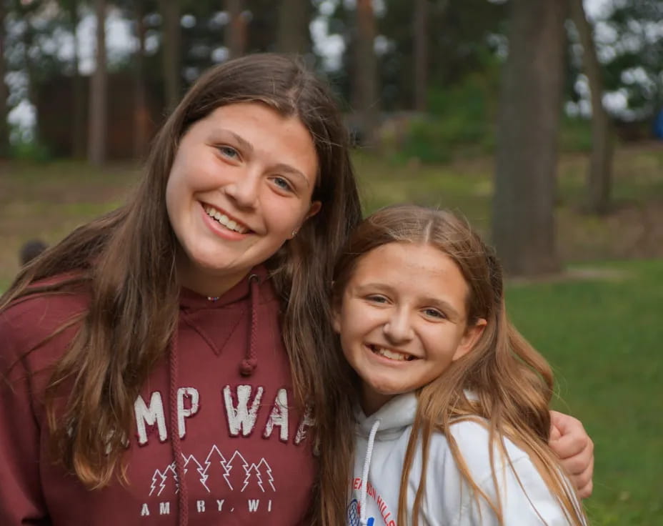 a person and a girl smiling