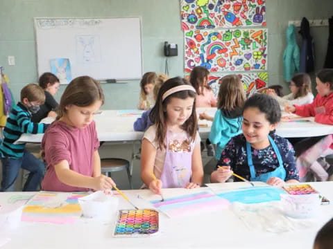 a group of children sitting at a table