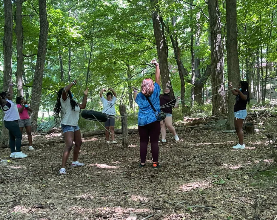 a group of people in a forest