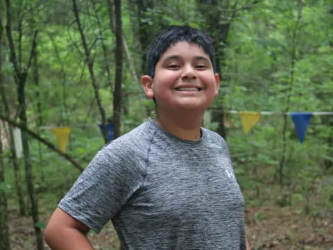 a boy smiling for the camera