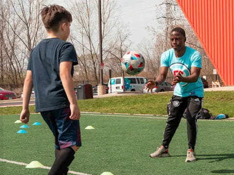 a couple of men playing football