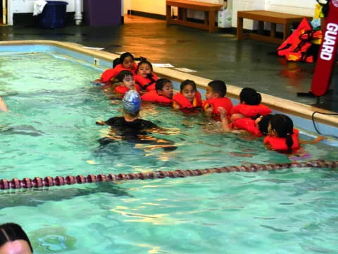 a group of people in a pool