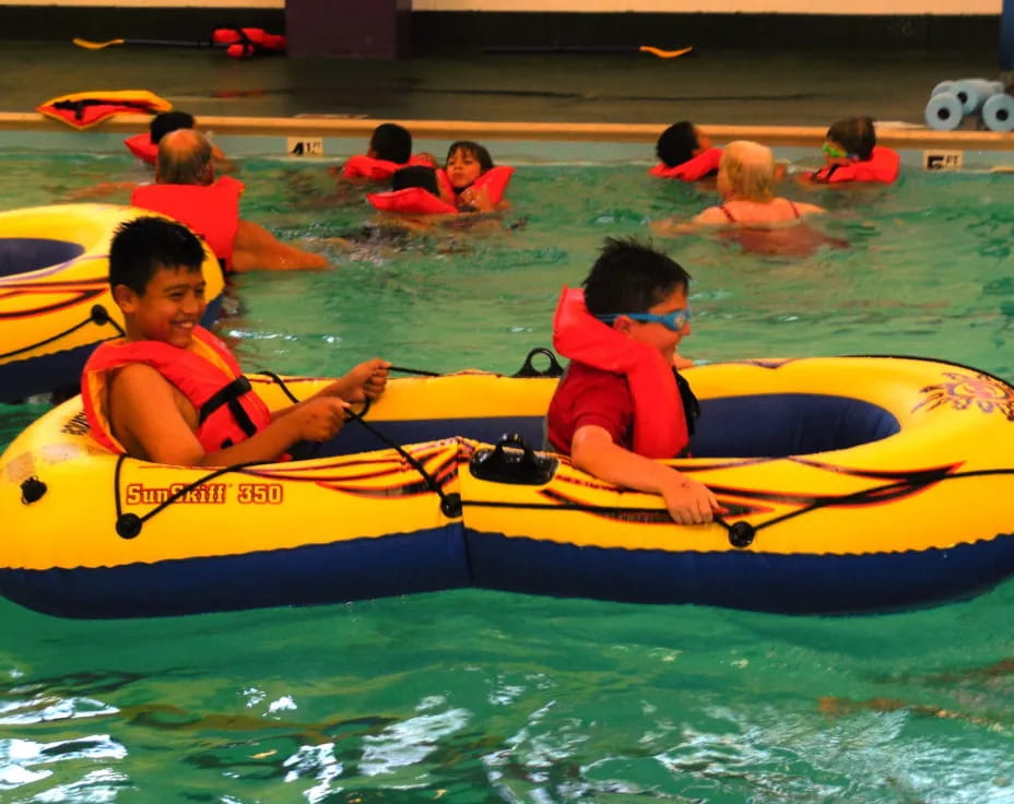 a group of people in a raft