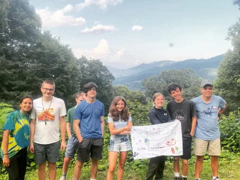 a group of people holding a sign