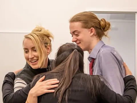 a group of people hugging