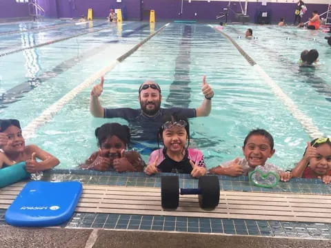 a group of people in a pool