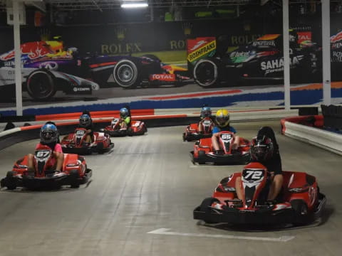 a group of people in go carts on a track