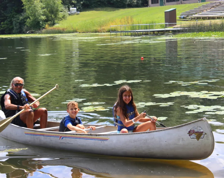 a group of people in a canoe