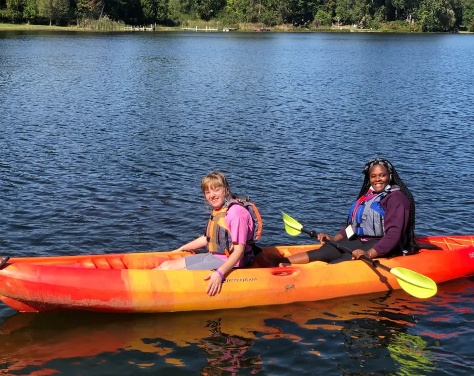 a group of people in a canoe