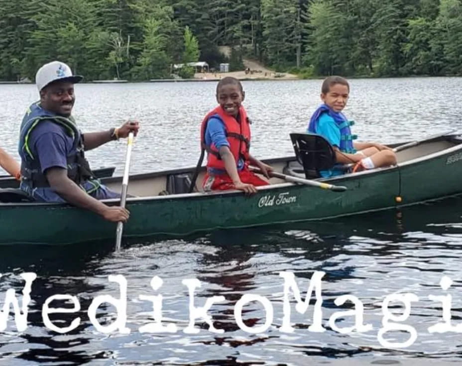 a group of people in a canoe