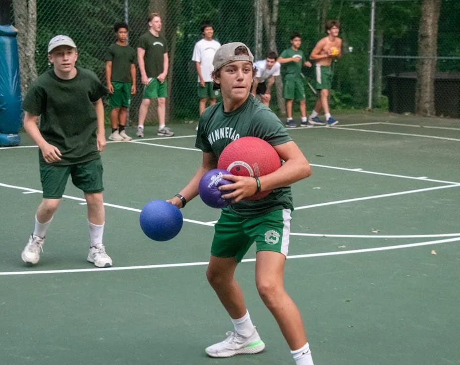 a person holding a ball