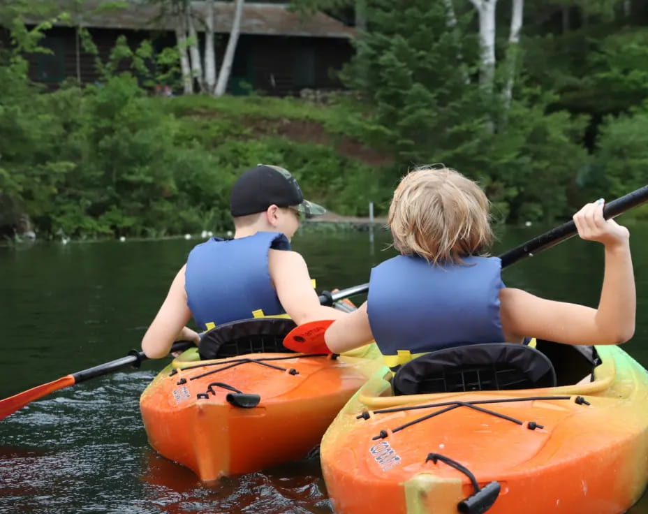 a couple of people in a canoe