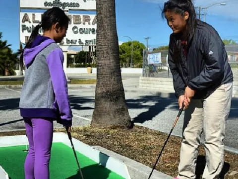 a person and a girl painting