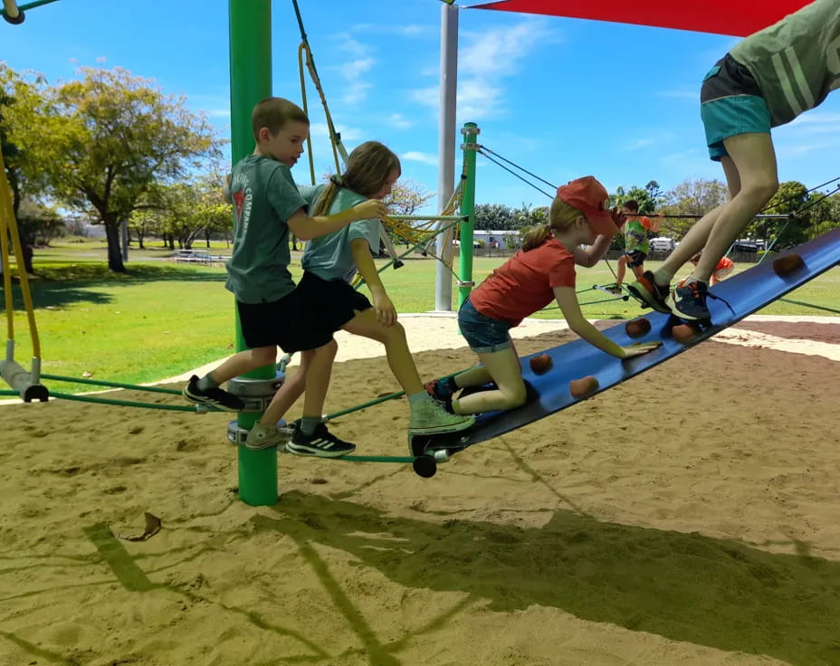 a group of kids playing on a playground