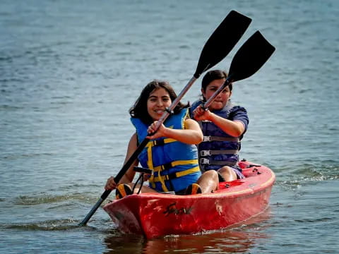 a couple of people in a canoe