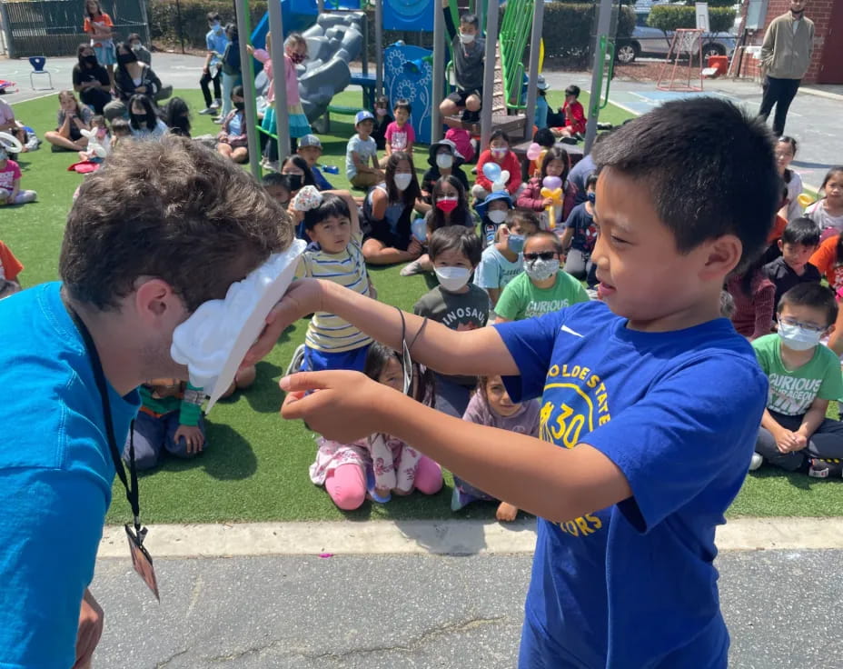 a group of kids playing with a ball
