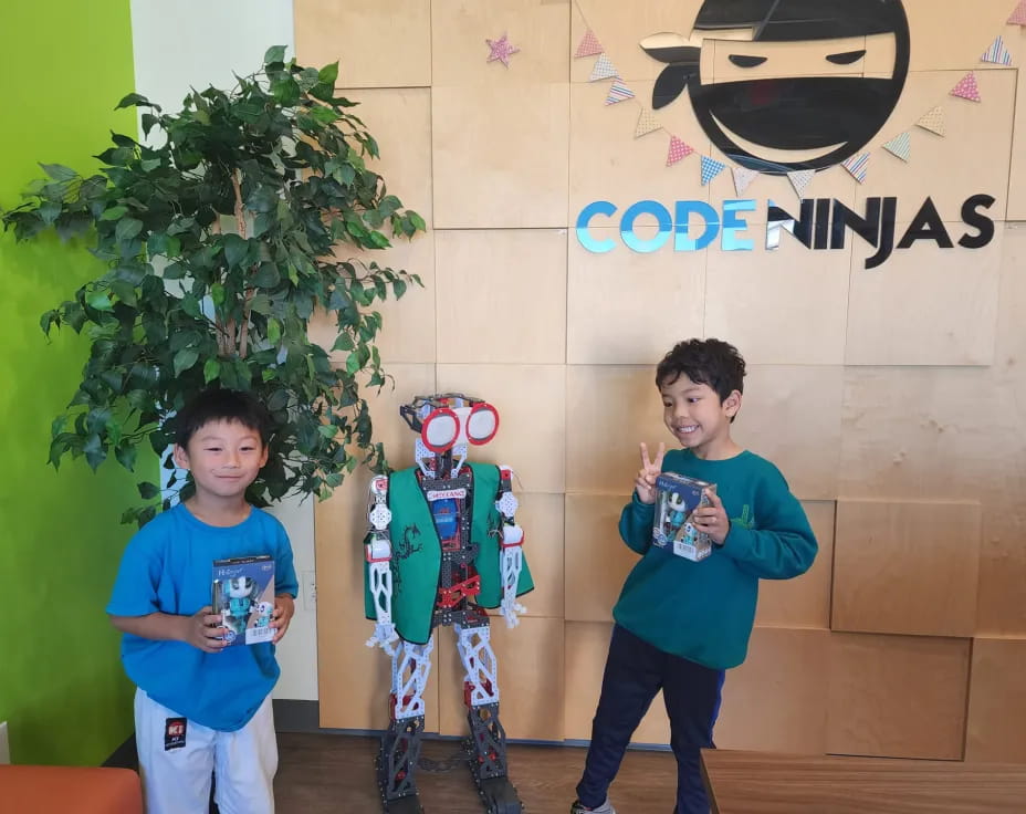 a couple of boys holding toys