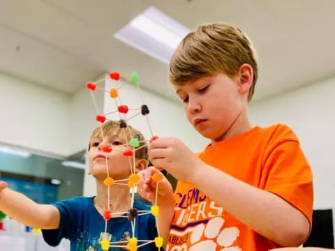a boy holding a doll