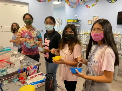 a group of people wearing masks