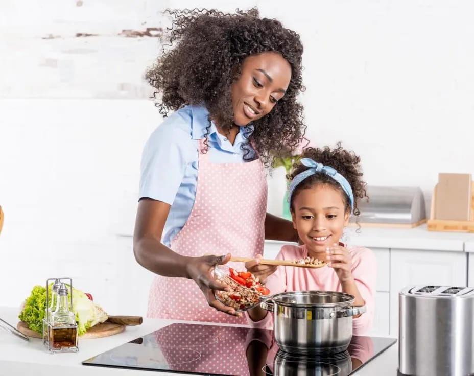 a person and a child cooking