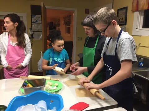 a group of people in a kitchen