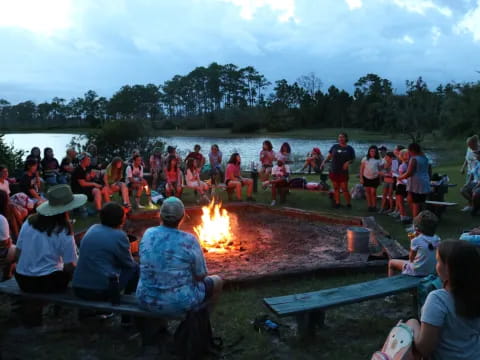 a group of people around a fire