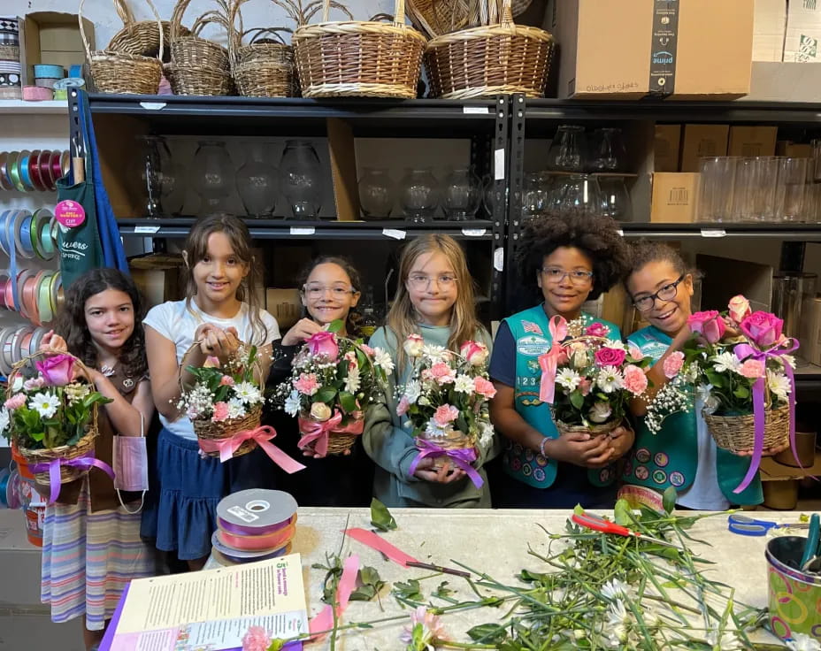 a group of people holding flowers