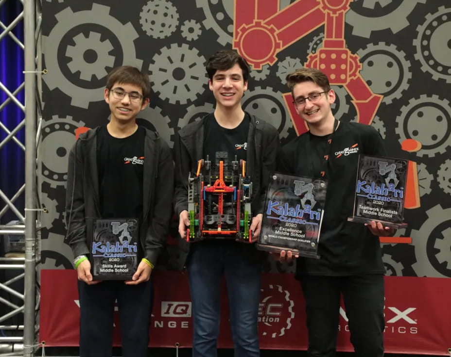 a group of men holding awards