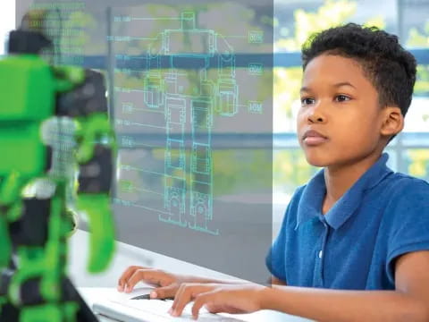 a young boy using a computer
