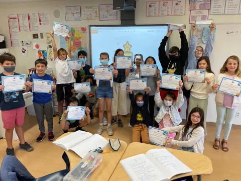 a group of children holding signs