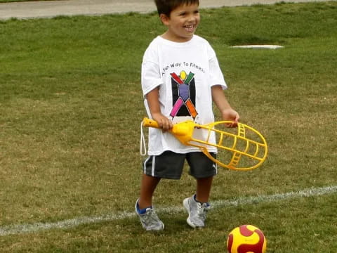 a boy holding a tennis racket