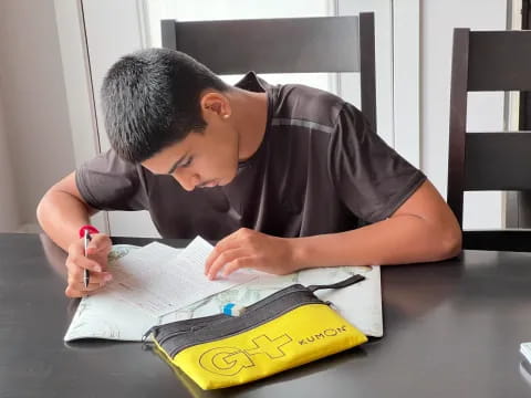 a person writing on a book