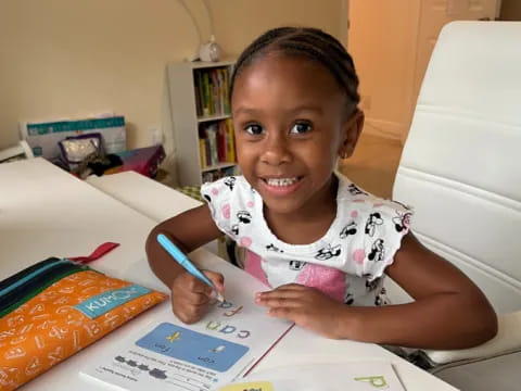 a child sitting at a table
