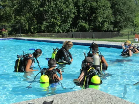 a group of people in a pool