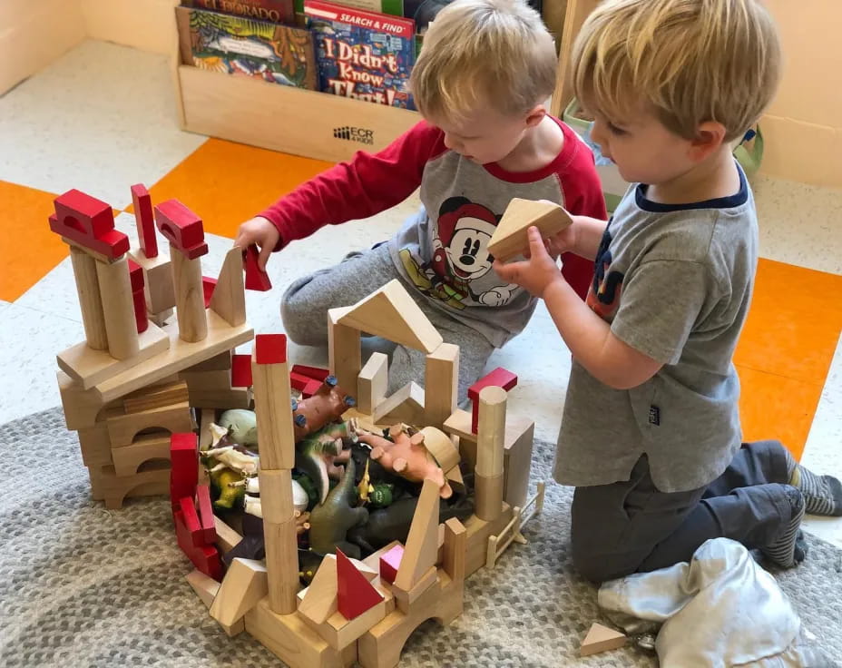 a couple of kids playing with toys