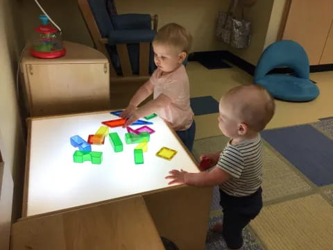 two boys playing with toys